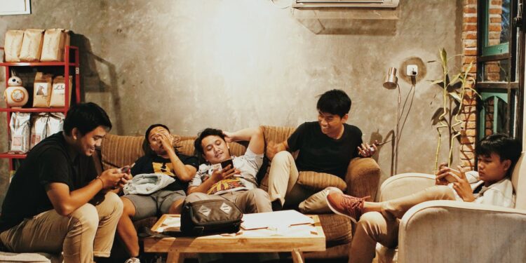 men sits of sofa | Seven Social Sins According To Mahatma Gandhi | 1 must follow