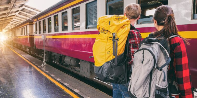 woman and man waiting on train station