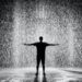 silhouette and grayscale photography of man standing under the rain Send Down The Rain