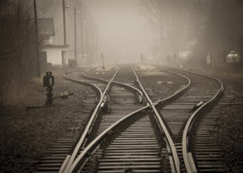 railroad tracks in city | Poem: To The Next Station