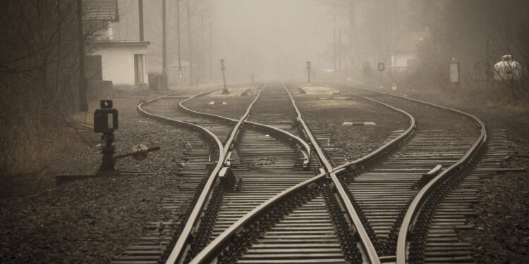 railroad tracks in city | Poem: To The Next Station