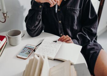 person sitting on wooden chair