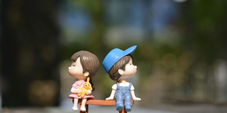 boy and girl sitting on bench toy: Explore why saying “I love you” feels so hard—and how vulnerability, fear, and love languages shape the way we express love. Let it out, imperfect but real.