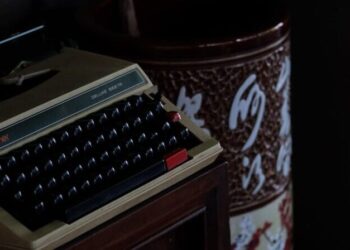 vintage typewriter in dimly lit room: As AI tools evolve, many writers are wondering: “Why does this sound like me?” A quiet, honest look at authorship, consent, and creativity.