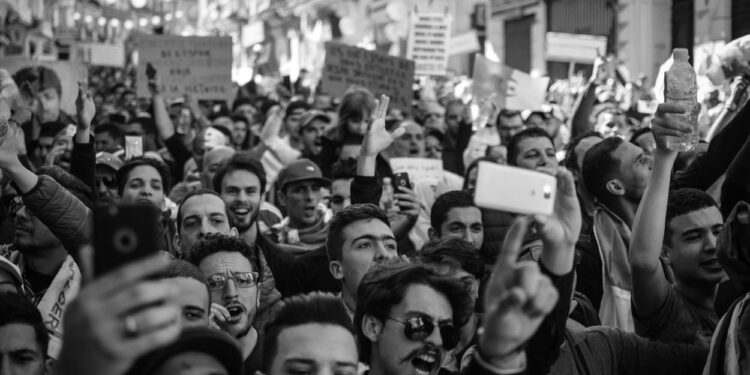 A haunting poem about the collapse of American innocence. Coming Home From an America Riot contrasts nostalgic childhood memories with present-day violence. Includes full poem and analysis.